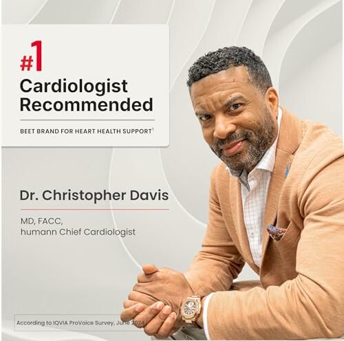Smiling man in suit, promoting cardiologist recommended beet brand.
