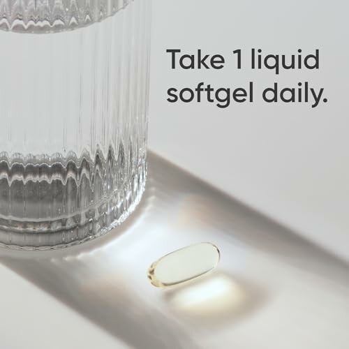 Glass of water with a softgel capsule and dosage instruction.